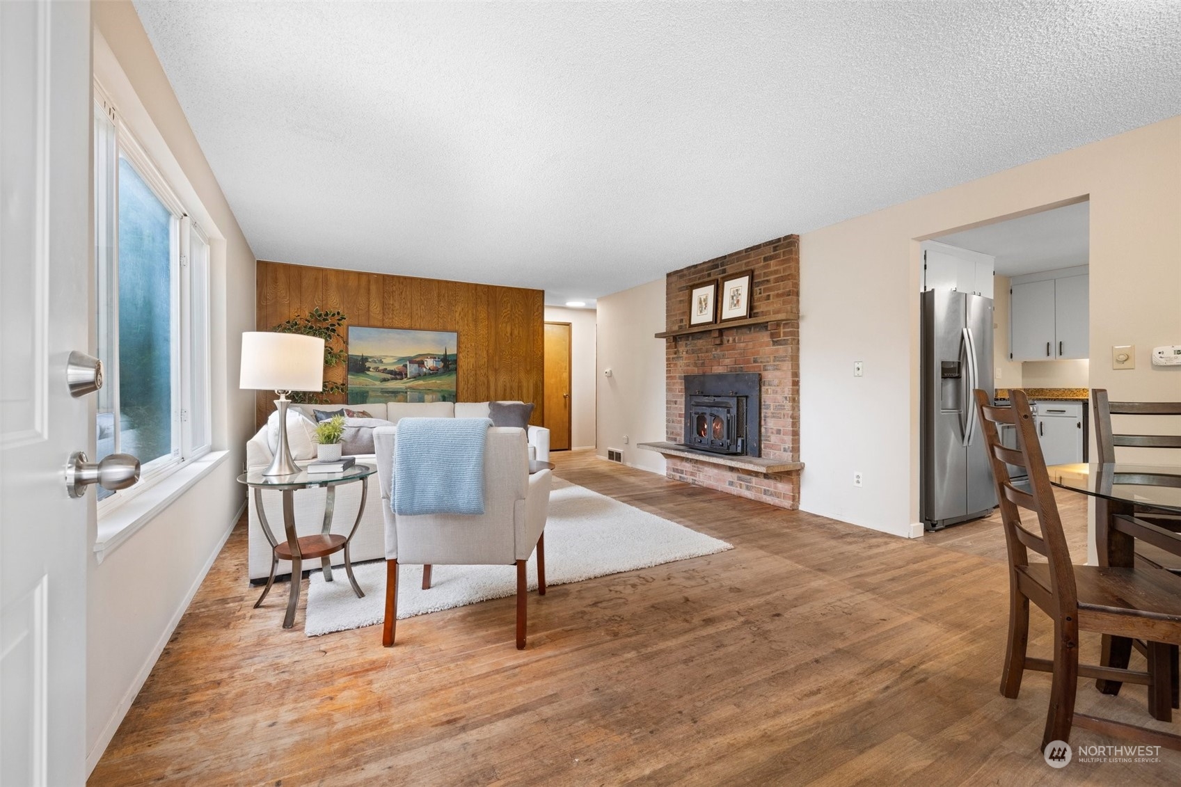 826 Southwest Dash Point Road Federal Way, WA 98023 - Photo 6 of 29 a living room with furniture and a wooden floor