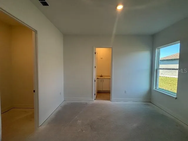 a bathroom with a granite countertop toilet a sink and bathtub