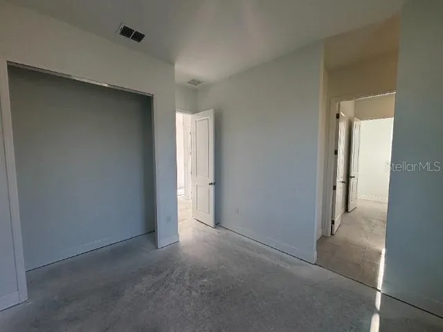 a bathroom with a granite countertop toilet a sink and a bathtub