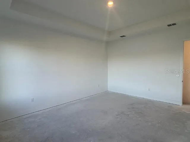 a bed room with a bed and a potted plant