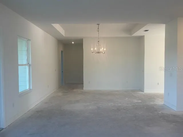 a kitchen with granite countertop a sink and cabinets