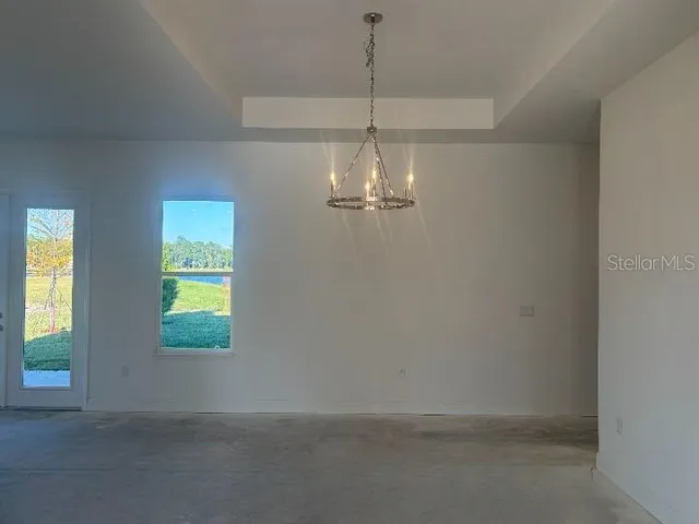 a large kitchen with stainless steel appliances granite countertop a sink a stove and a refrigerator