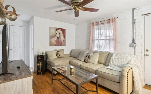 a living room with furniture and a window