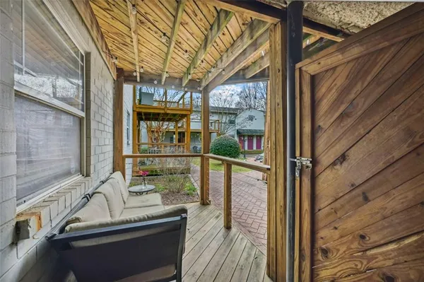 a view of balcony with furniture