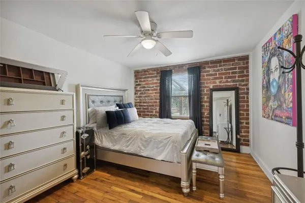 a bedroom with a bed and window