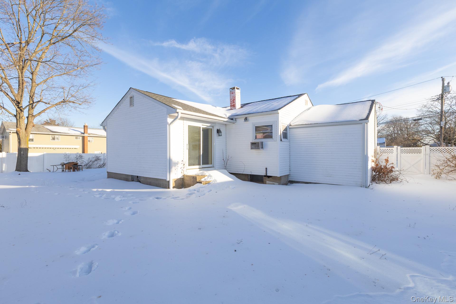 3 Exeter Road East Patchogue, NY 11772 - Photo 16 of 20 Sliding door to primary bedroom