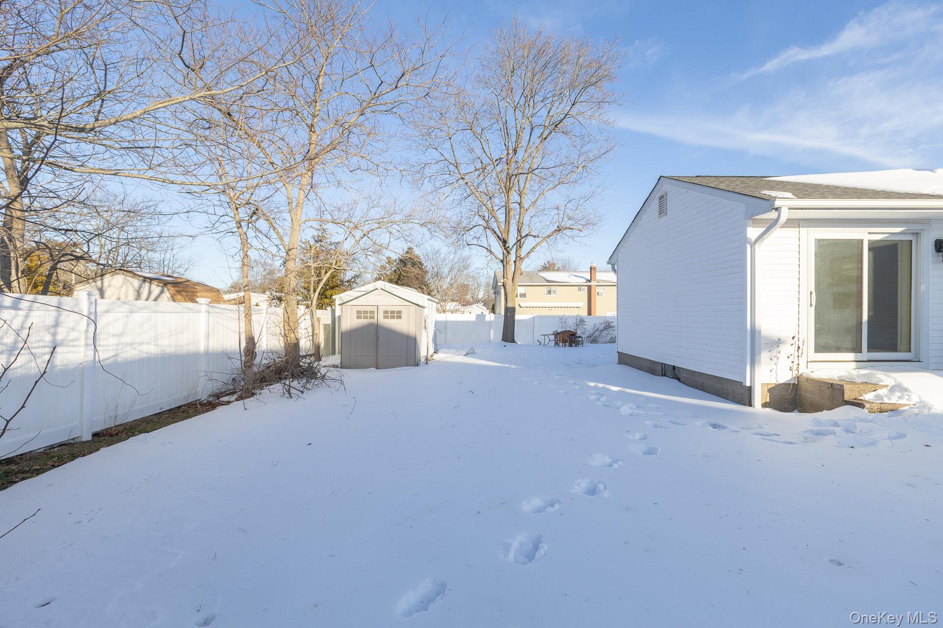 3 Exeter Road East Patchogue, NY 11772 - Photo 17 of 20 Sliding door to primary bedroom
