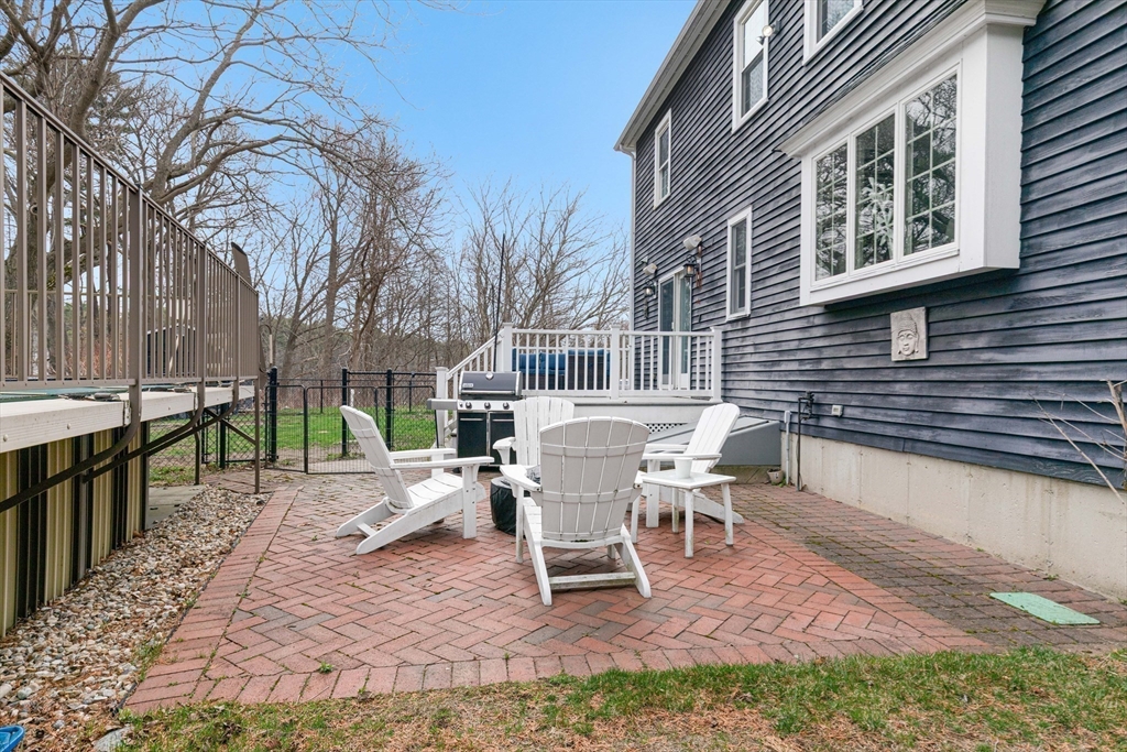 54 Old Merrill Street Amesbury, MA 01913 - Photo 33 of 34 a white bench sitting in front of a house