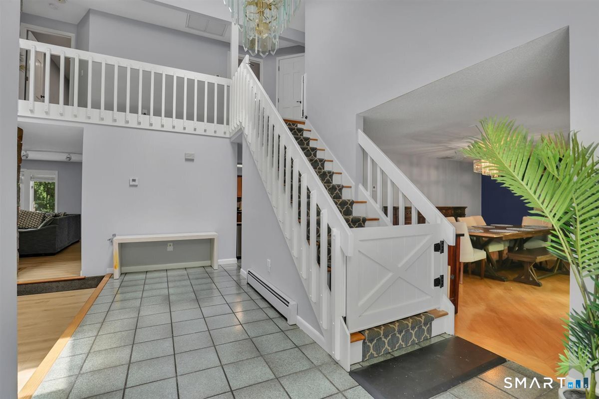 8 Pond View Road Bolton, CT 06043 - Photo 18 of 39 The extra wide stairway leads to the 2nd level and bedroom retreats.