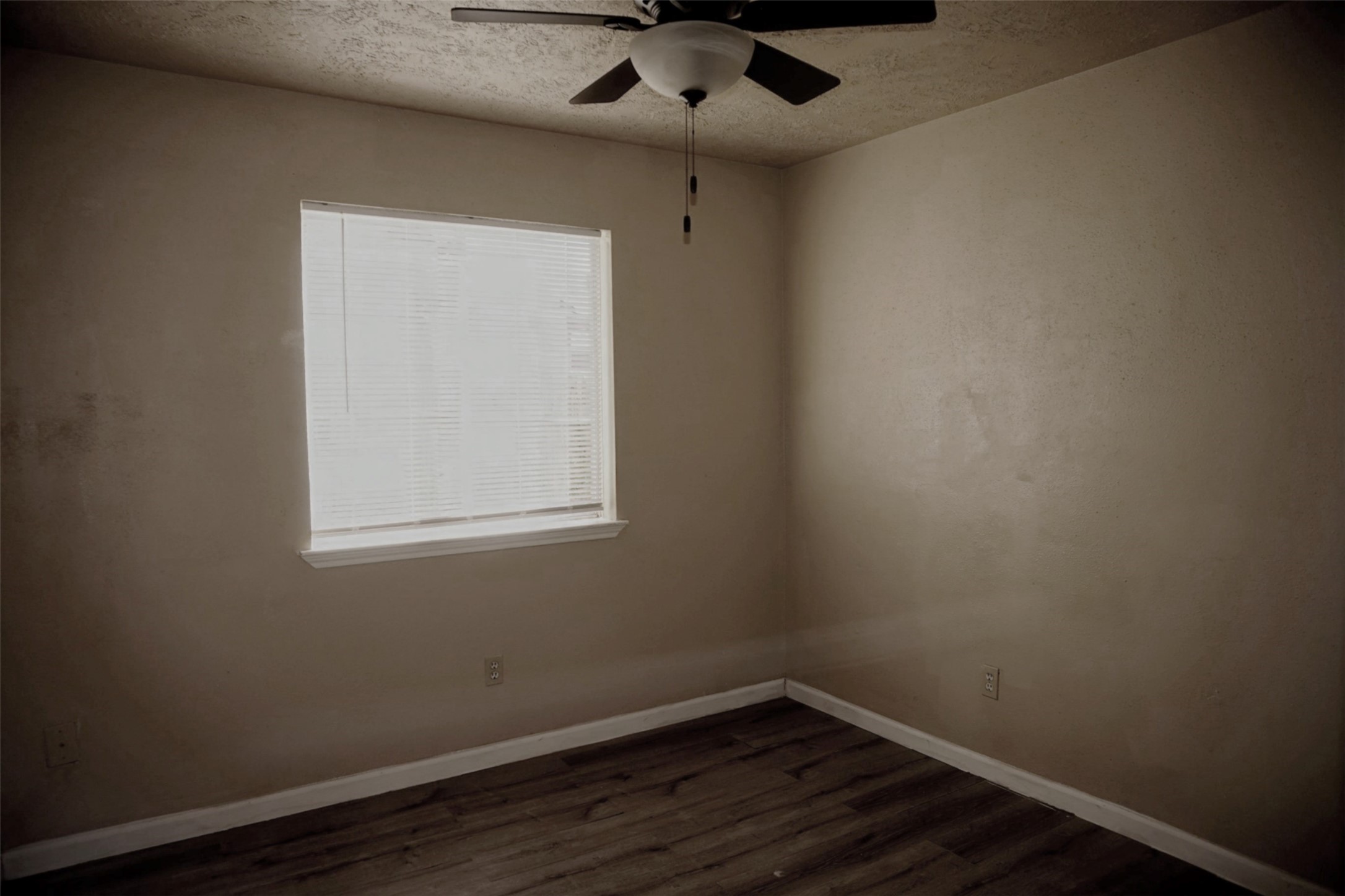 6023 Woodmancote Drive Humble, TX 77346 - Photo 11 of 12 an empty room with a window