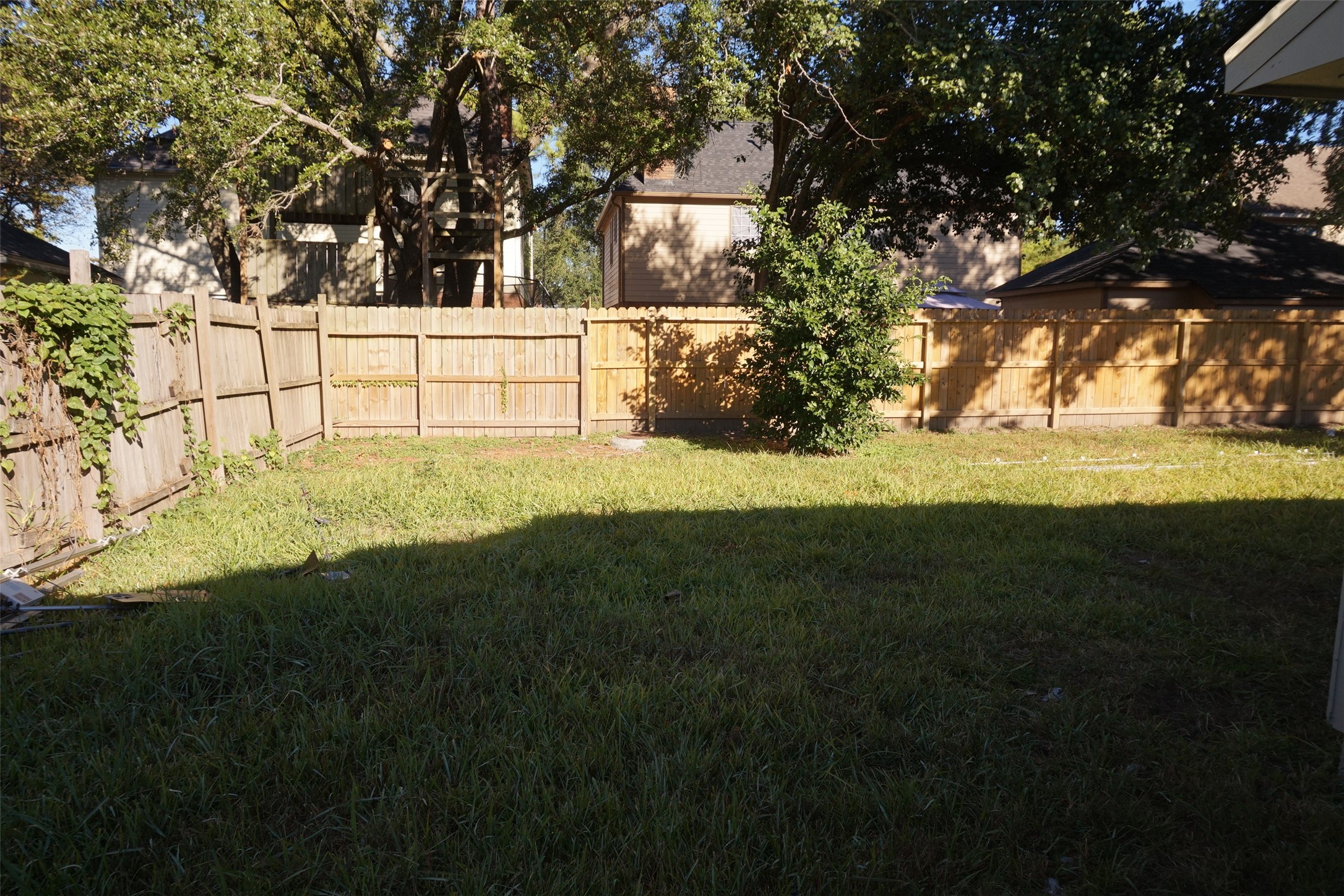 6023 Woodmancote Drive Humble, TX 77346 - Photo 12 of 12 a view of back yard of the house with green space