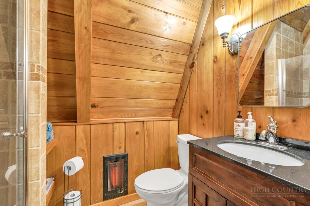 233 Cherry Drive Boone, NC 28607 - Photo 9 of 20 a bathroom with a granite countertop sink toilet and shower