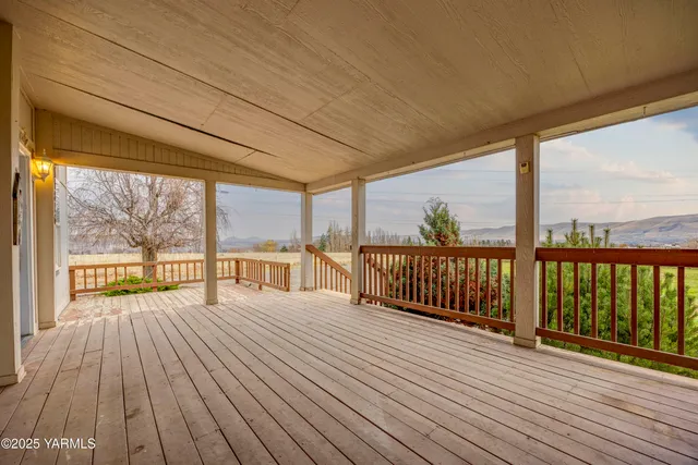 a view of balcony with wooden floor