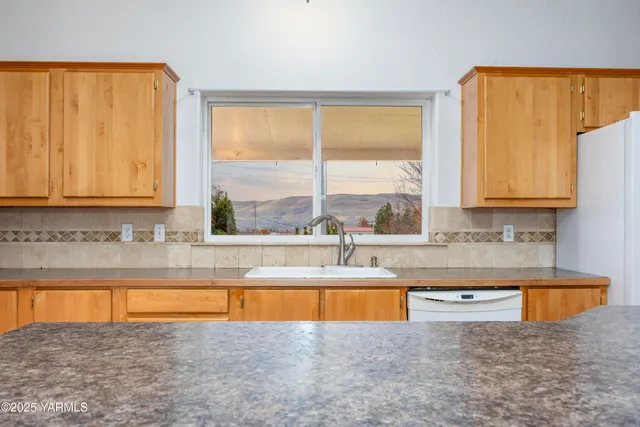 a view of a kitchen with swimming pool and a window