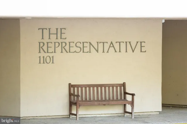 a view of swimming pool with palm trees