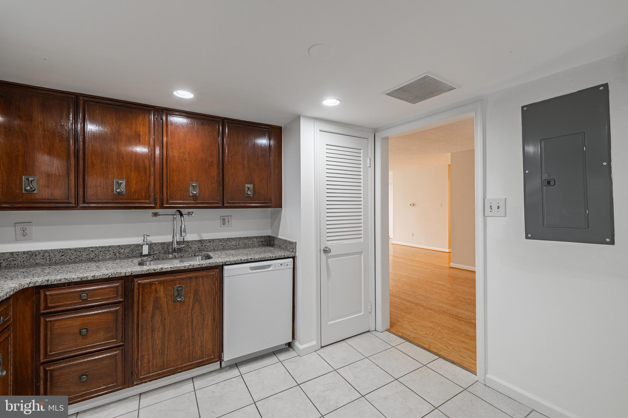 1101 South Arlington Ridge Road, Unit 704 Arlington, VA 22202 - Photo 31 of 70 a kitchen with a sink and cabinets
