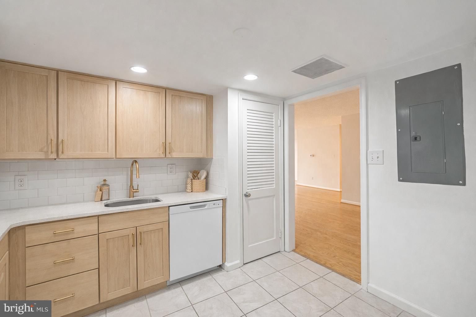 1101 South Arlington Ridge Road, Unit 704 Arlington, VA 22202 - Photo 32 of 70 a view of a kitchen with white cabinets
