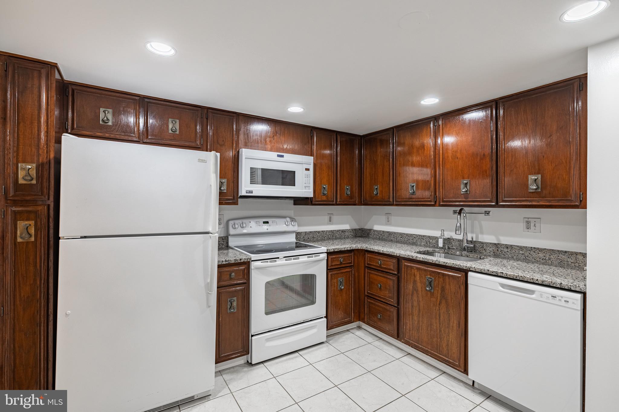 1101 South Arlington Ridge Road, Unit 704 Arlington, VA 22202 - Photo 35 of 70 a kitchen with a sink appliances and cabinets