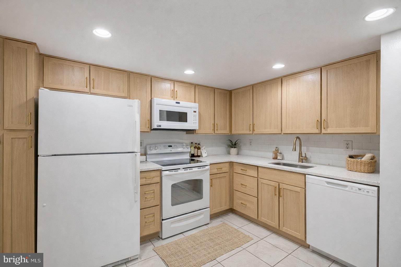 1101 South Arlington Ridge Road, Unit 704 Arlington, VA 22202 - Photo 36 of 70 a white refrigerator freezer sitting inside of a kitchen