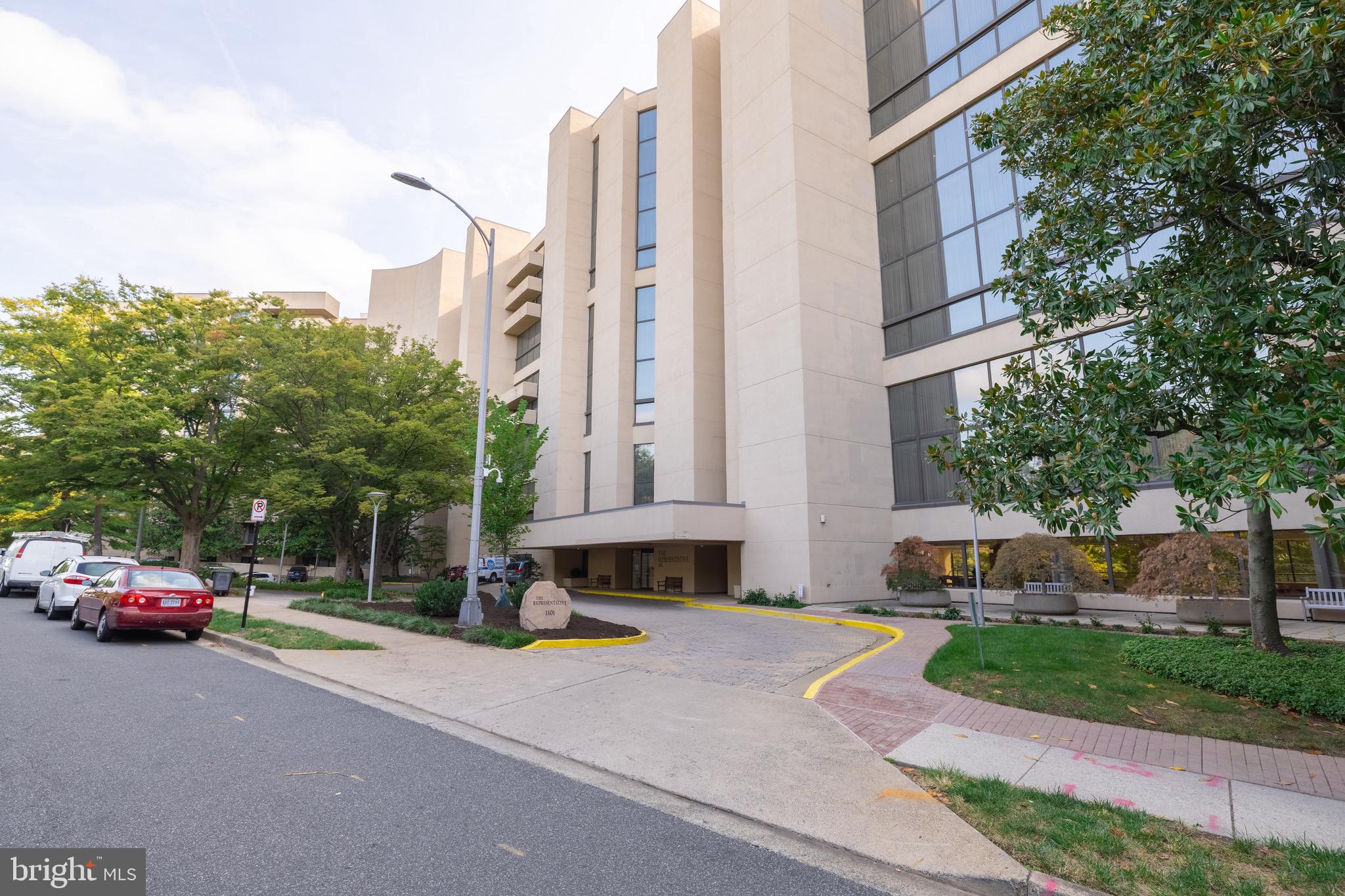1101 South Arlington Ridge Road, Unit 704 Arlington, VA 22202 - Photo 7 of 70 a cars parked in front of a building