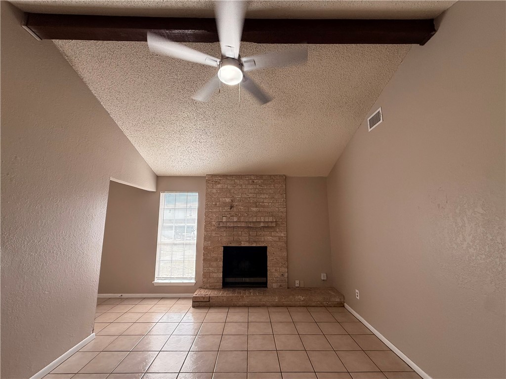 5018 Wingfoot Lane, Unit A Corpus Christi, TX 78413 - Photo 3 of 13 a view of an empty room with a fireplace