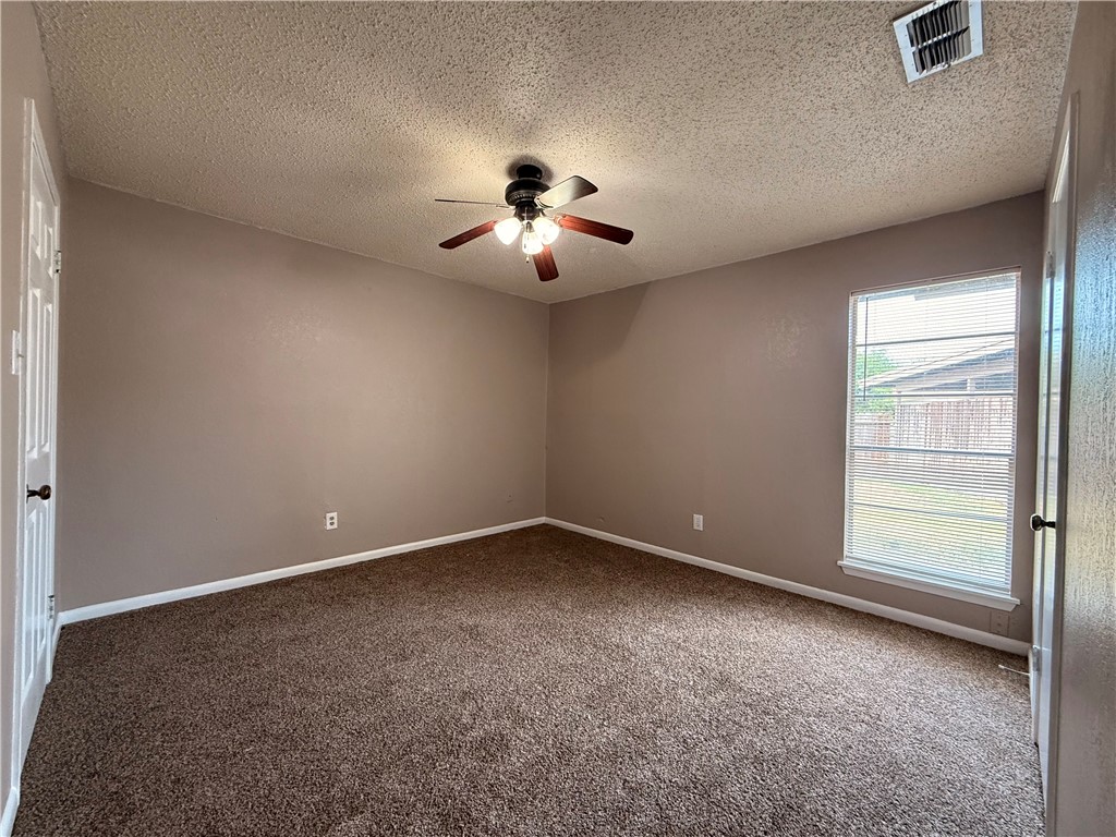 5018 Wingfoot Lane, Unit A Corpus Christi, TX 78413 - Photo 7 of 13 an empty room with a window