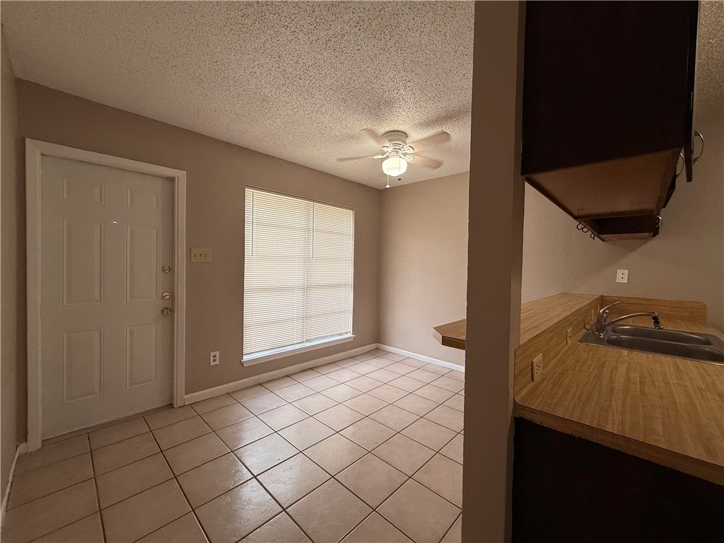 5018 Wingfoot Lane, Unit A Corpus Christi, TX 78413 - Photo 10 of 13 a view of empty room with wooden floor and fan