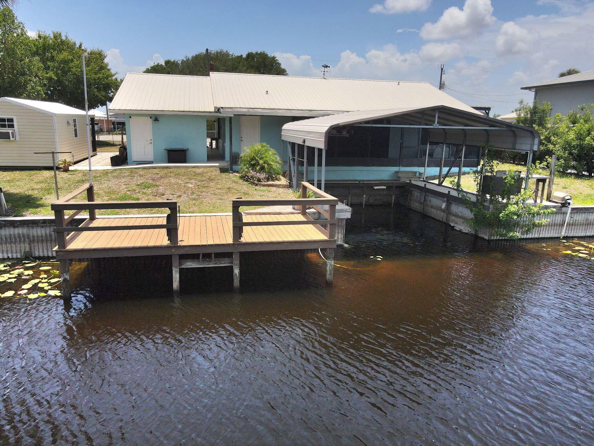 1115 Elm Street Okeechobee, FL 34974 - Photo 2 of 37 a view of a swimming pool with a patio