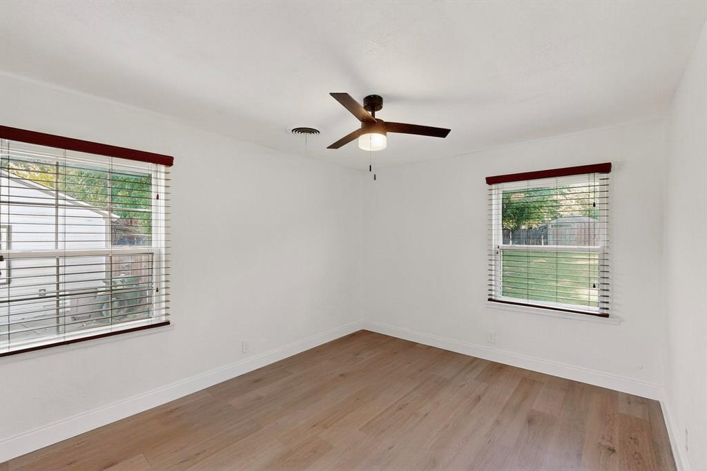1609 Biggs Terrace Arlington, TX 76010 - Photo 9 of 18 a view of a room with wooden floor and a window