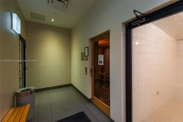 en suite bathroom with a sink and a mirror