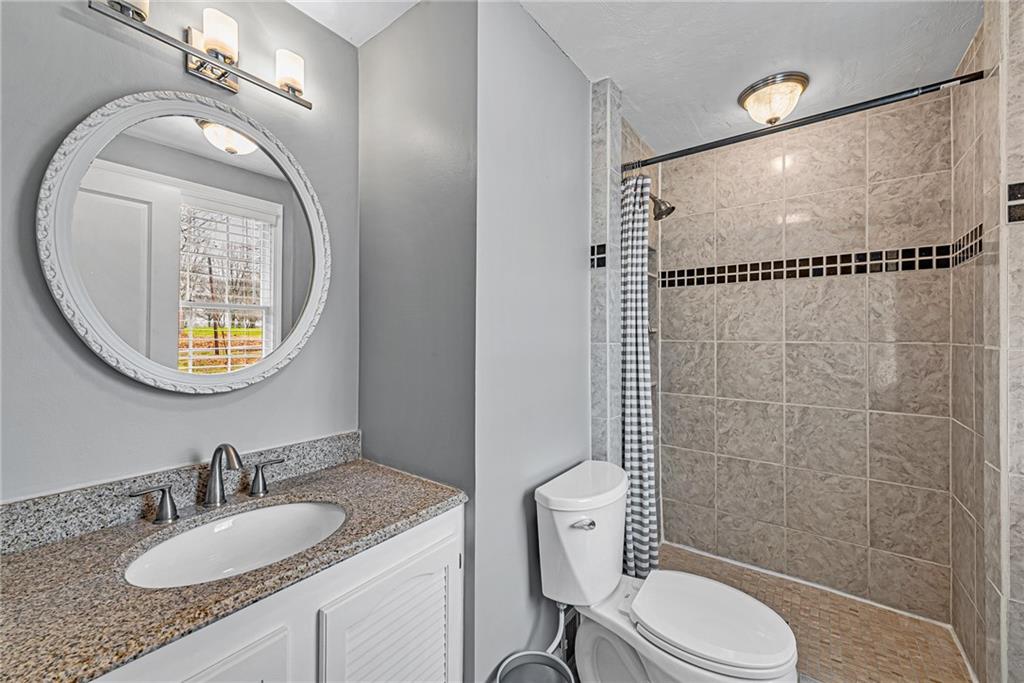 5868 Claridge Export Road Export, PA 15632 - Photo 16 of 25 a bathroom with a granite countertop sink mirror vanity and toilet