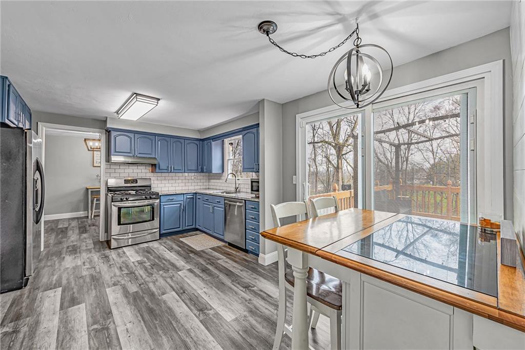 5868 Claridge Export Road Export, PA 15632 - Photo 10 of 25 a kitchen with stainless steel appliances granite countertop a stove and refrigerator