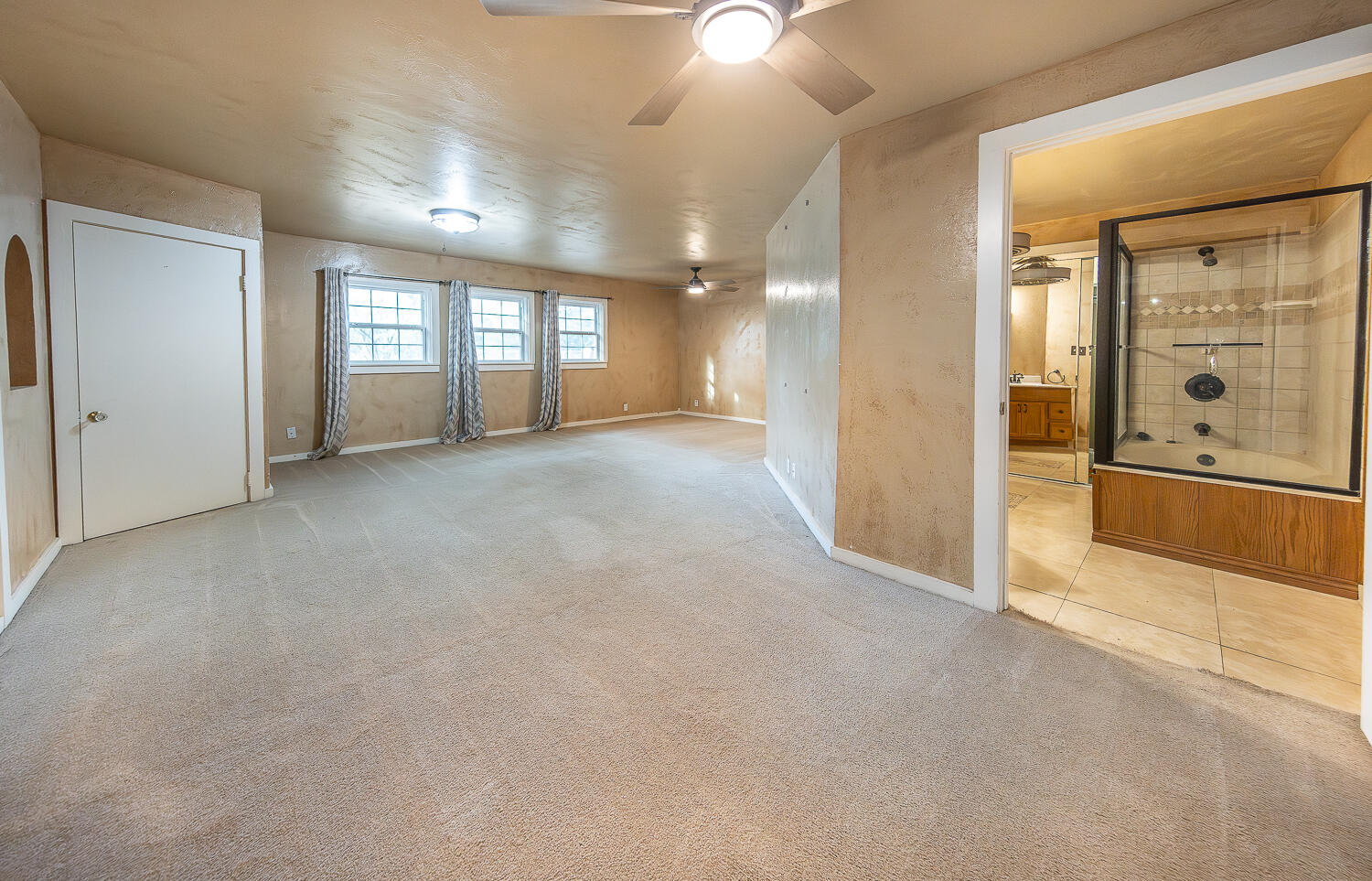 5104 19th Street Lubbock, TX 79407 - Photo 27 of 64 an empty room with windows and entrance