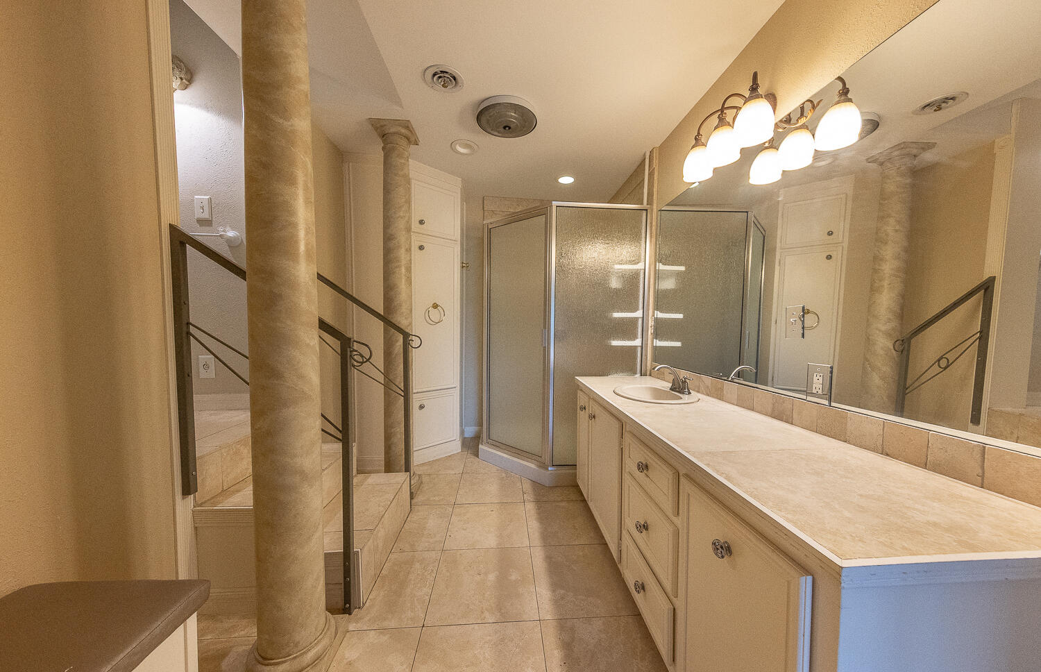 5104 19th Street Lubbock, TX 79407 - Photo 35 of 64 a bathroom with a double vanity sink mirror and shower