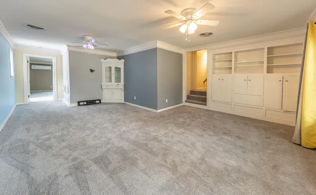 a view of house with outdoor space and parking