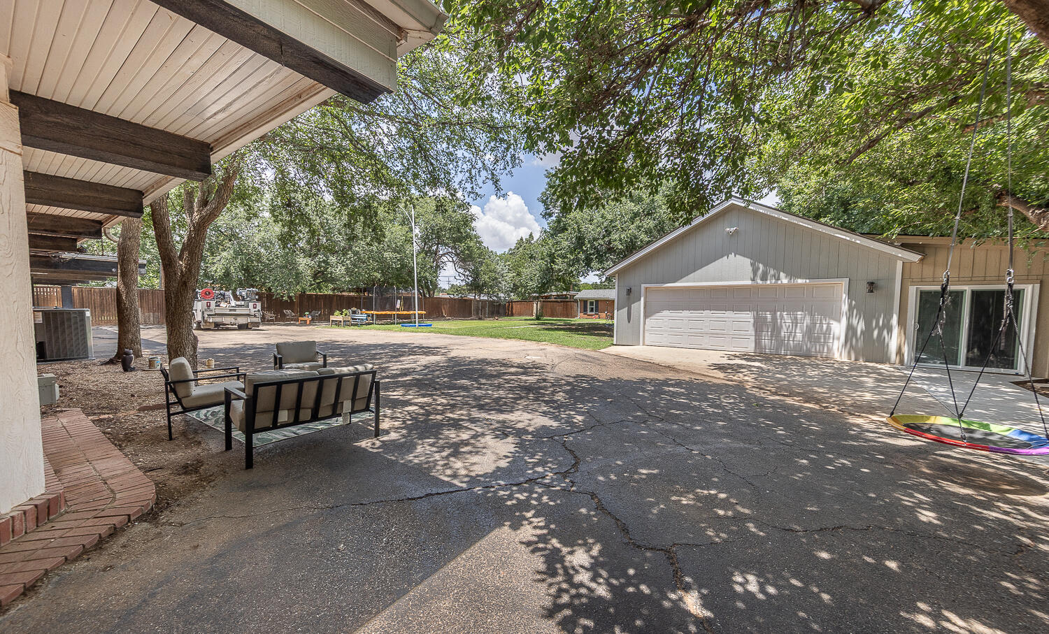 5104 19th Street Lubbock, TX 79407 - Photo 46 of 64 a view of a house with a yard and sitting area