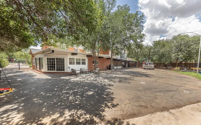 a kitchen with refrigerator and cabinets