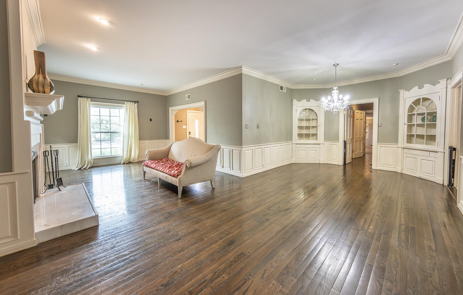 5104 19th Street Lubbock, TX 79407 - Photo 5 of 64 a living room with furniture and wooden floor
