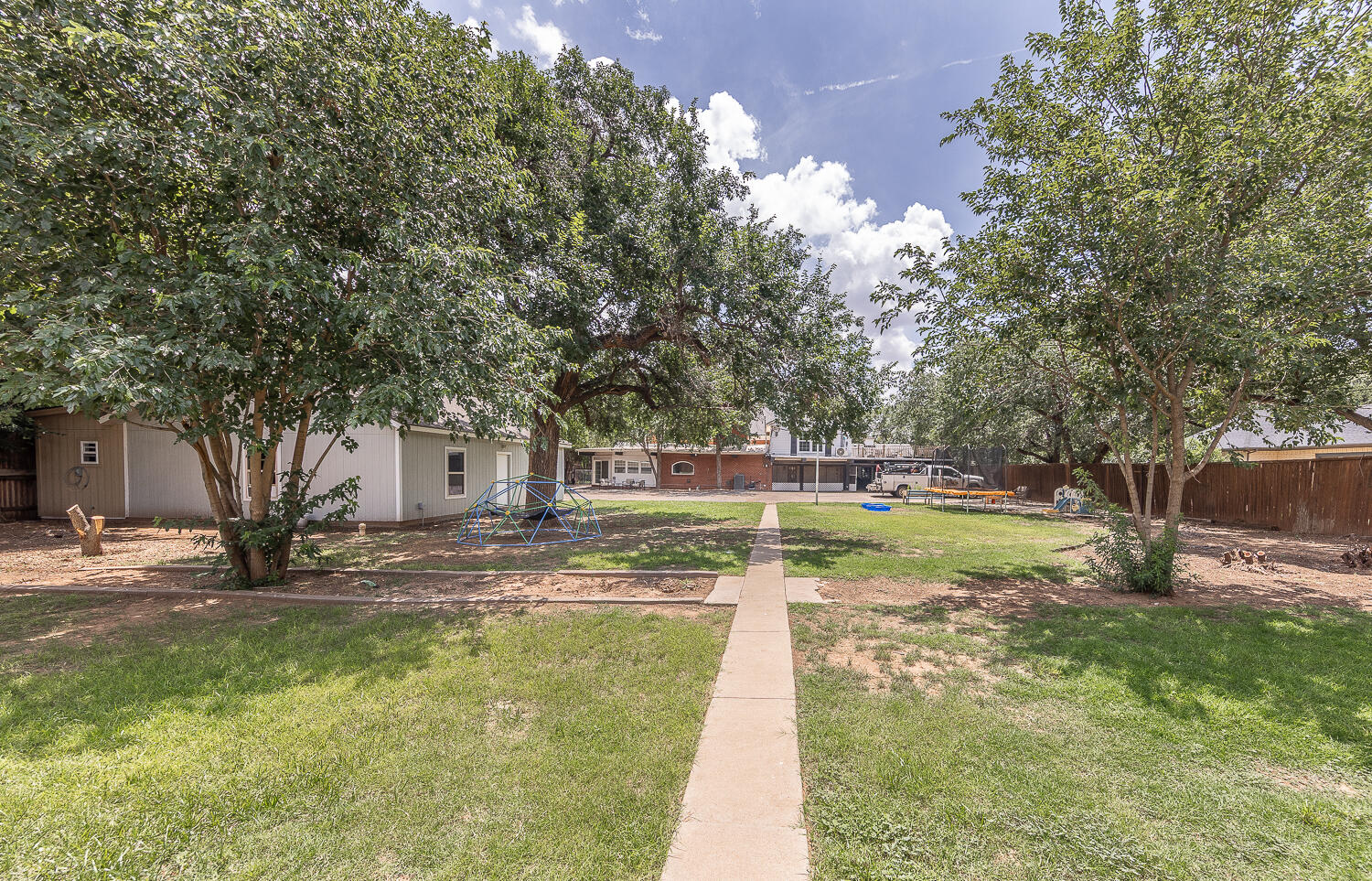 5104 19th Street Lubbock, TX 79407 - Photo 52 of 64 a view of a yard with swimming pool
