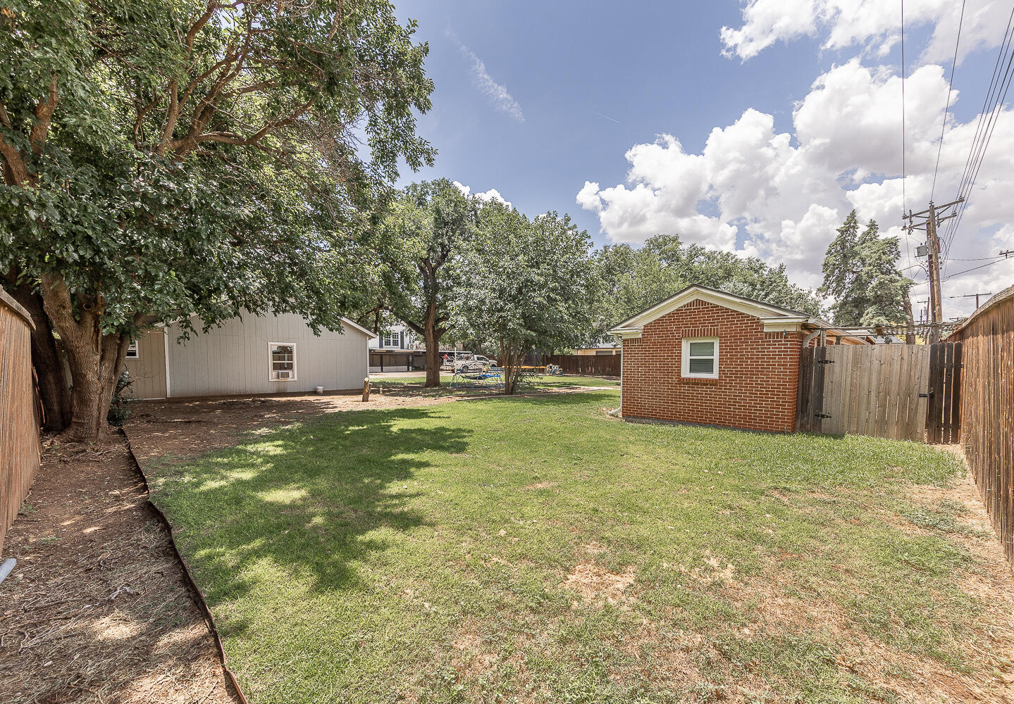 5104 19th Street Lubbock, TX 79407 - Photo 53 of 64 a view of a house with a yard
