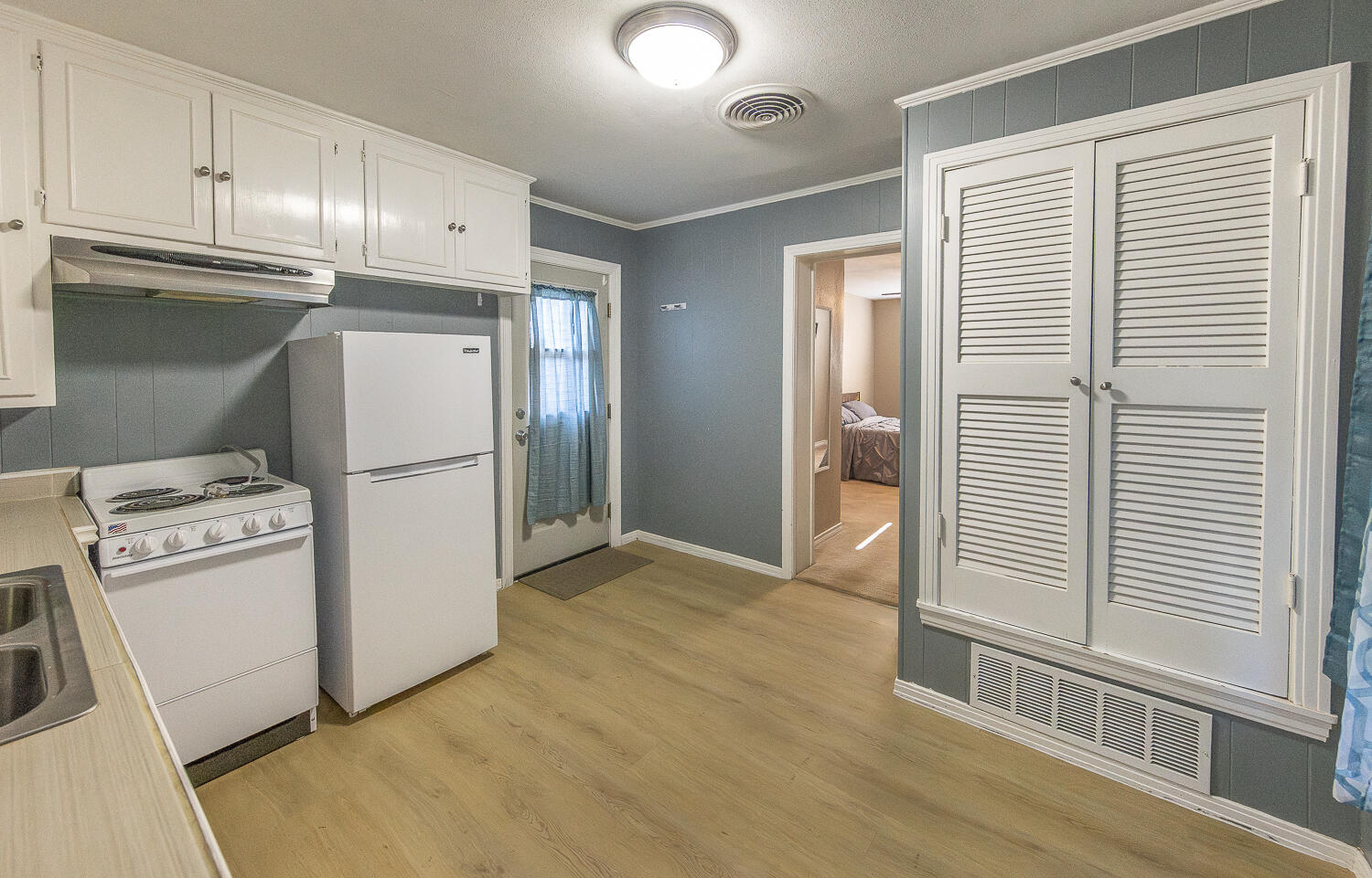 5104 19th Street Lubbock, TX 79407 - Photo 60 of 64 a kitchen with a refrigerator a washer and dryer