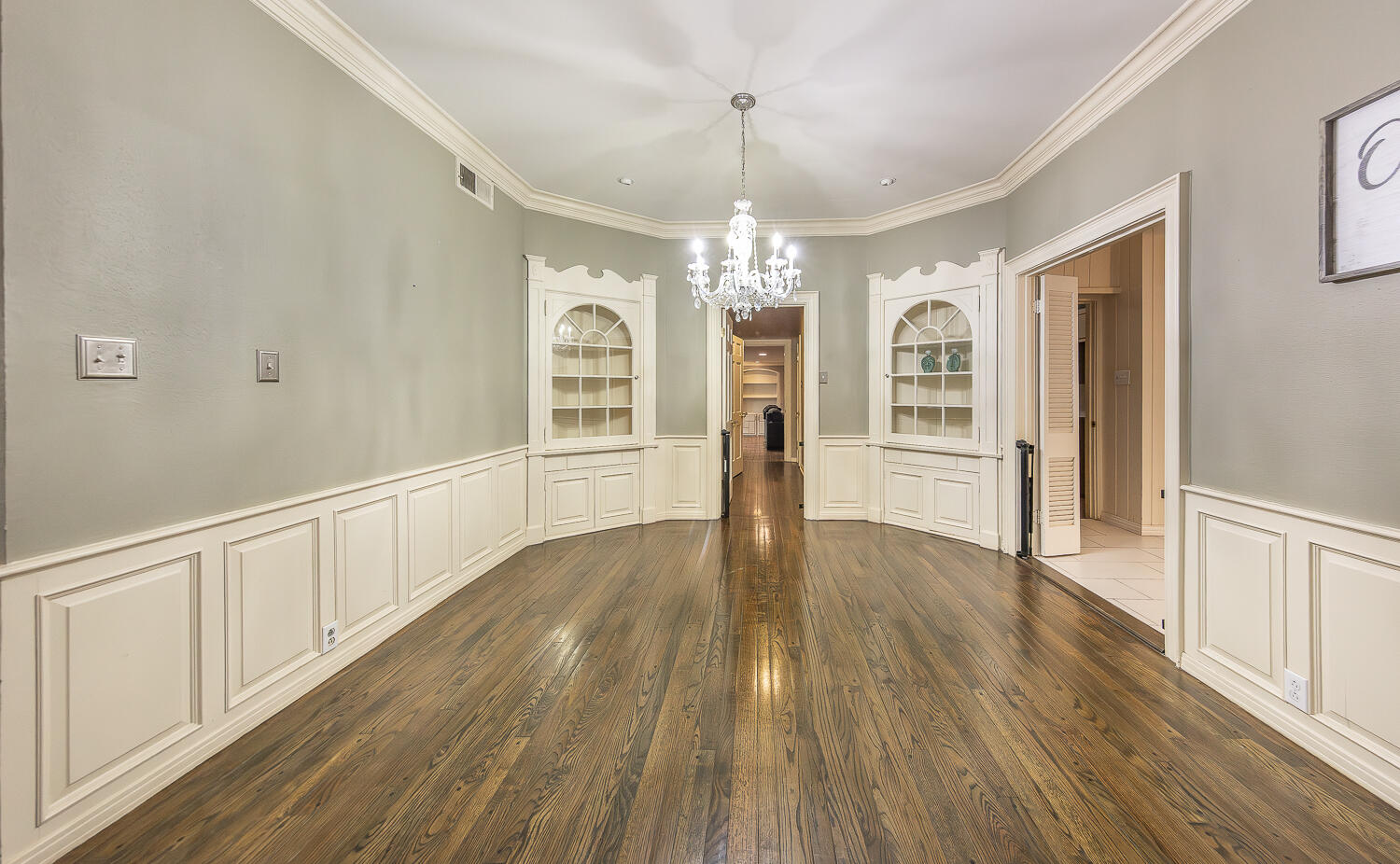 5104 19th Street Lubbock, TX 79407 - Photo 6 of 64 a view of an empty room with wooden floor and window