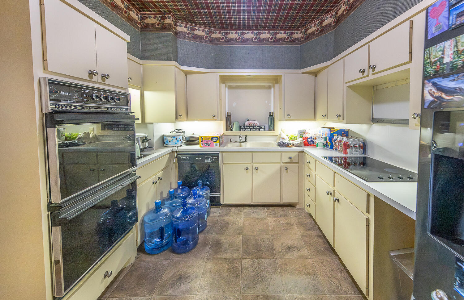 5104 19th Street Lubbock, TX 79407 - Photo 61 of 64 a kitchen with a sink stainless steel appliances and cabinets