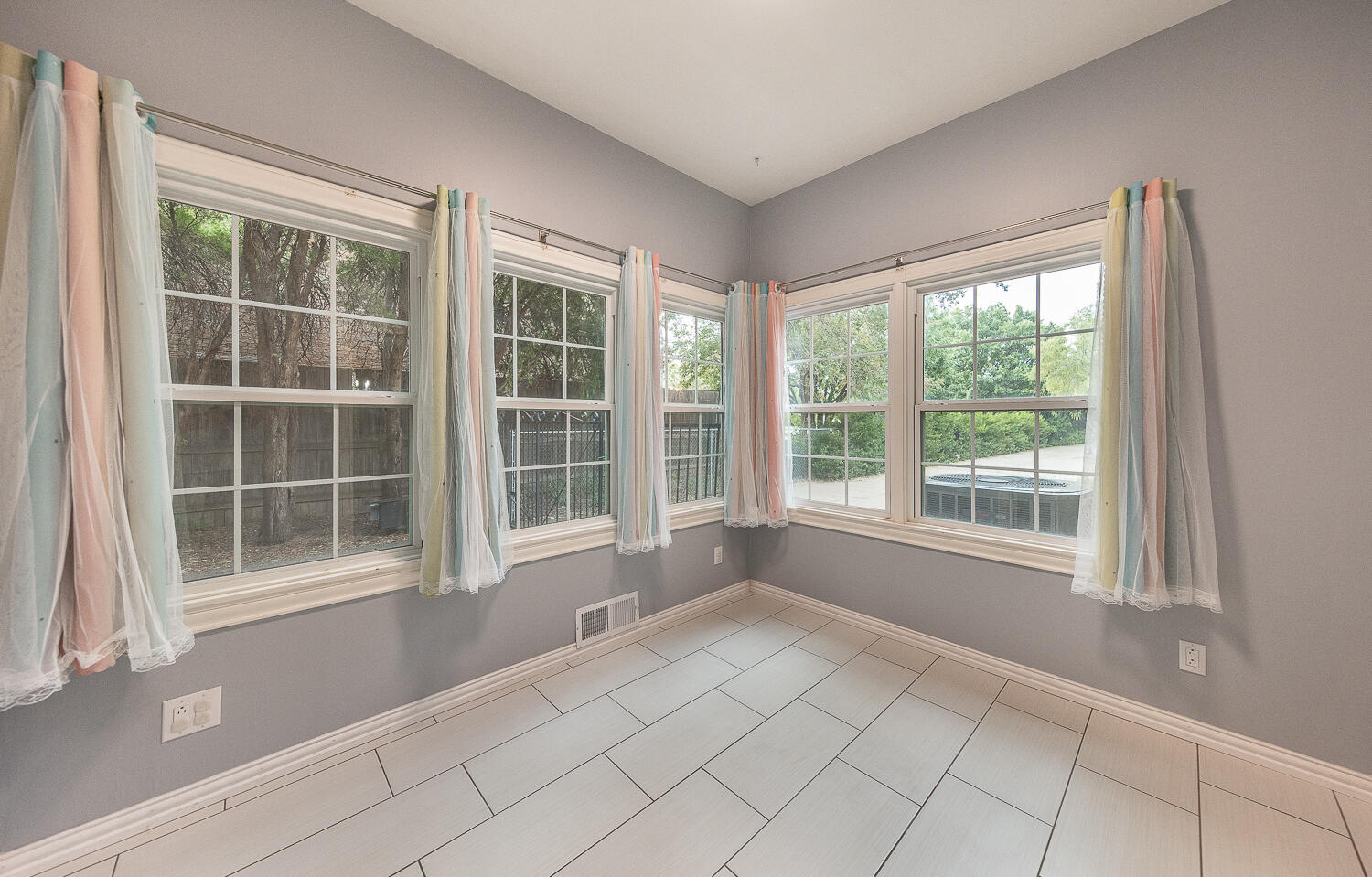 5104 19th Street Lubbock, TX 79407 - Photo 8 of 64 a view of empty room with windows