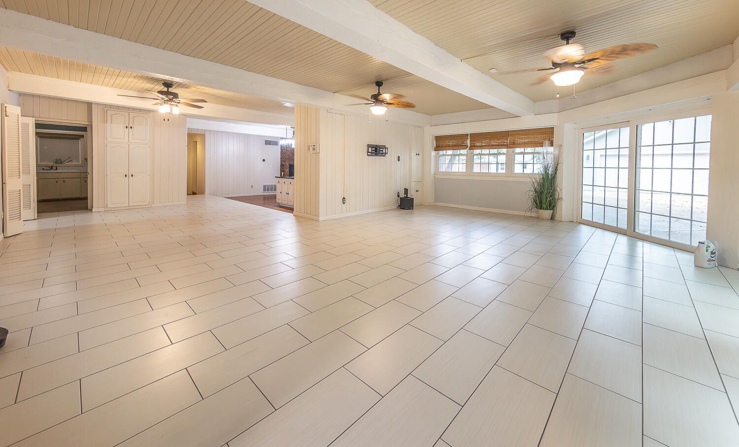 5104 19th Street Lubbock, TX 79407 - Photo 10 of 64 a view of a livingroom with a chandelier fan and windows