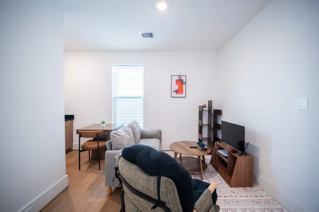 a bedroom with furniture and a window