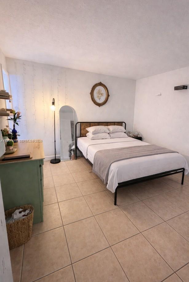 9459 Southwest 76th Street, Unit R8 Miami, FL 33173 - Photo 5 of 14 Master Bedroom
