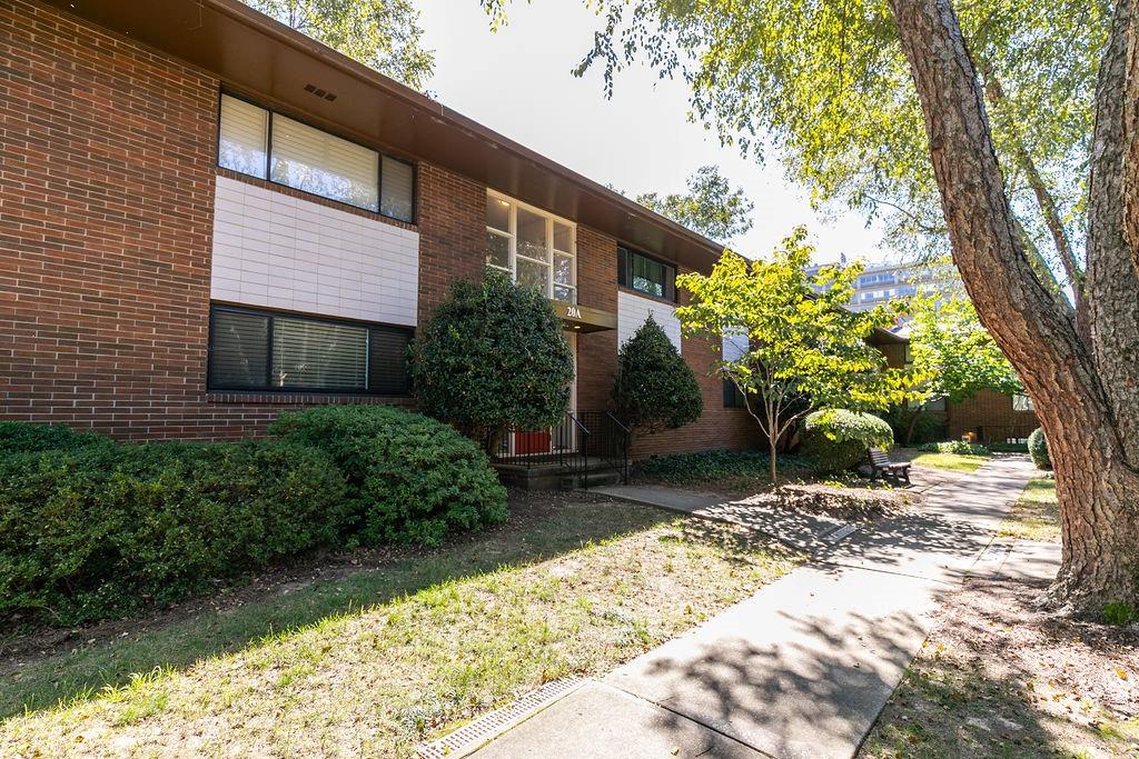 20 26th Street Northwest, Unit A4 Atlanta, GA 30309 - Photo 1 of 1 a backyard of a house with lots of green space