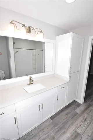 a bathroom with a sink and a mirror