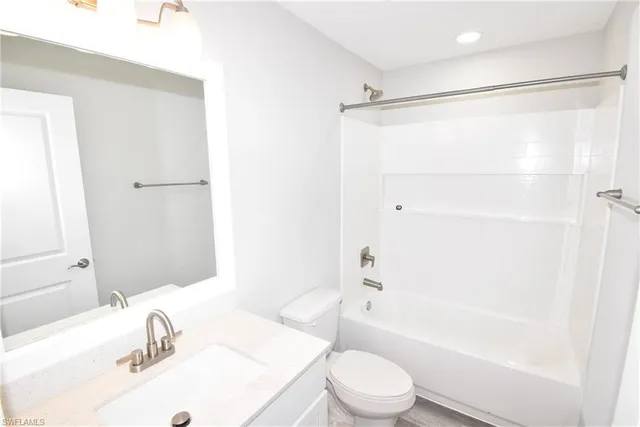 a bathroom with a sink a toilet and a bathtub